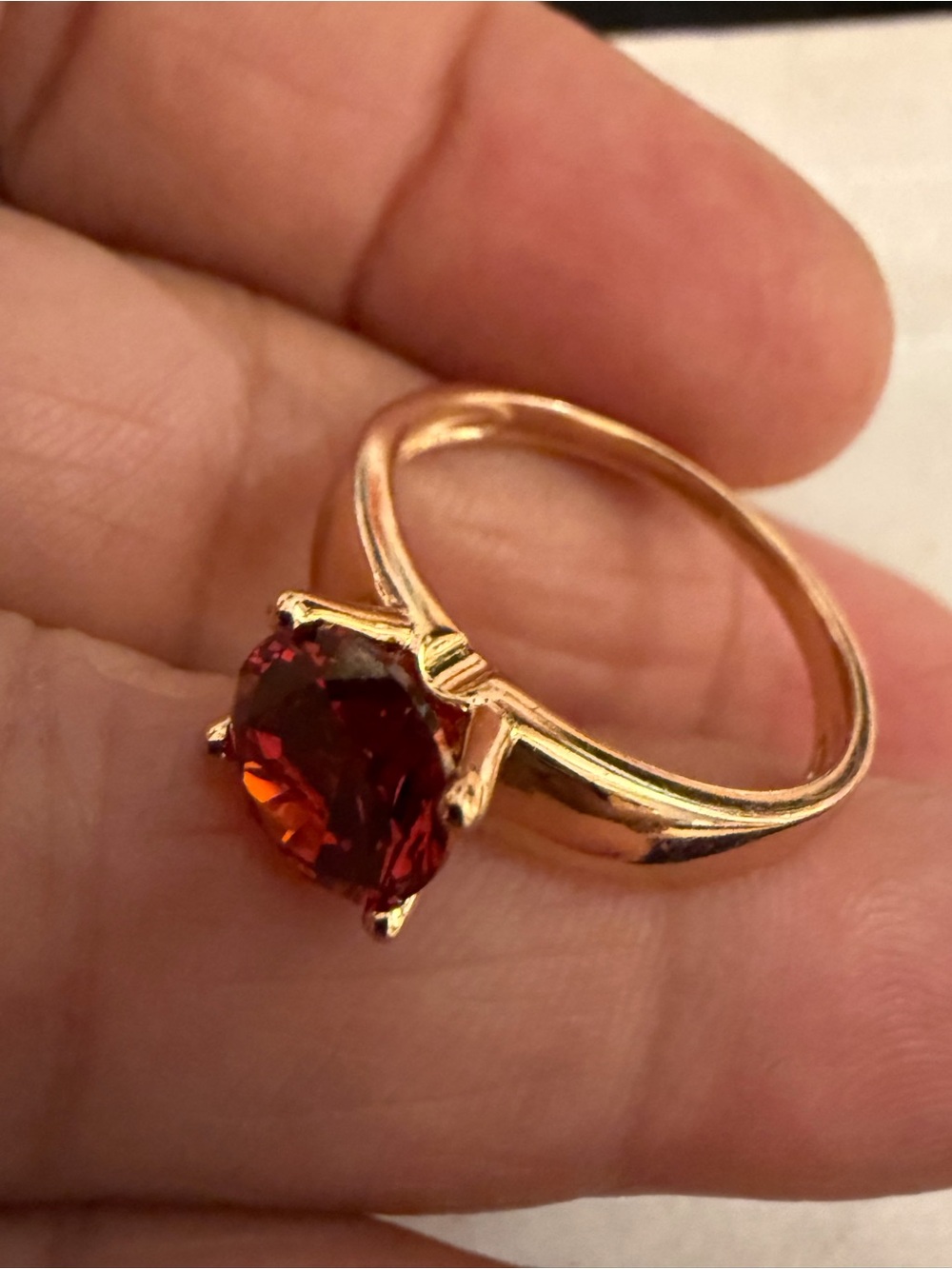 Elegant Gold Ring with Deep Red Gemstone